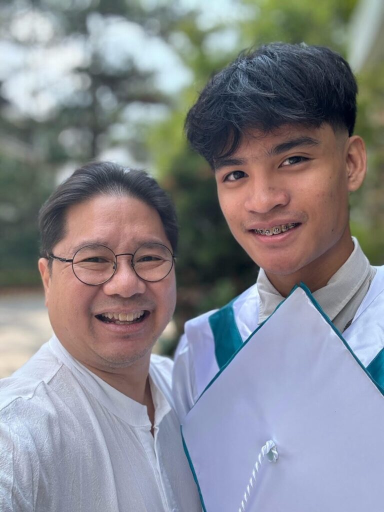 Banner photo: Beeto on a Disney cruise with his dad. Photo above: Author Gabe Mercado and son Beeto who graduated from senior high school on June 12, 2024. The boy who was predicted to not excel in school is starting his studies in Lithuania in September.